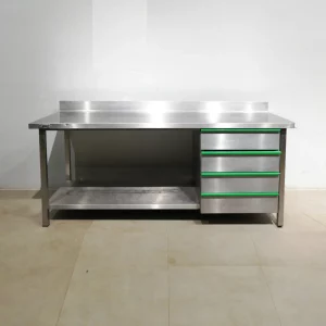 Taula d'acer inoxidable de segona mà amb lleixa inferior i 4 calaixos (200x70x92cm) en venda a cabauoportunitats.com