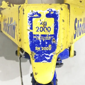 Transpaleta manual de ocasión STÖCKLIN 2000kg en buen estado, procedente de una empresa en cierre